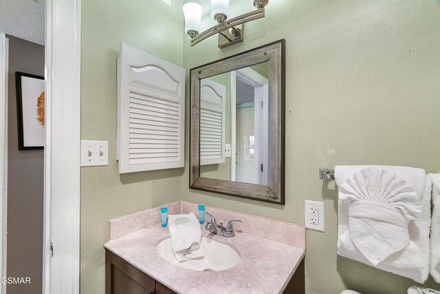 bathroom with vanity and a textured ceiling