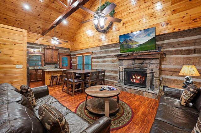 living room featuring ceiling fan, beam ceiling, high vaulted ceiling, wooden ceiling, and dark hardwood / wood-style floors