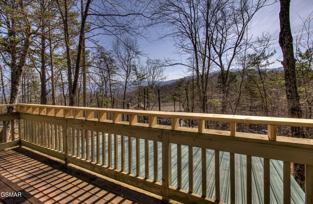 1125 Tanrac Trl, Gatlinburg, TN 37738 - wooden deck with a wooded view
