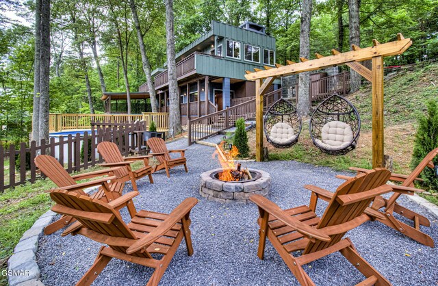 1125 Tanrac Trl, Gatlinburg, TN 37738 - view of patio featuring an outdoor fire pit and a deck