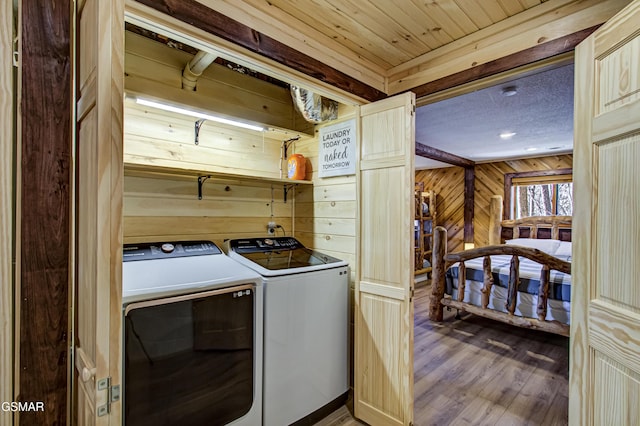1125 Tanrac Trl, Gatlinburg, TN 37738 - washroom featuring wood walls, wood finished floors, laundry area, and independent washer and dryer