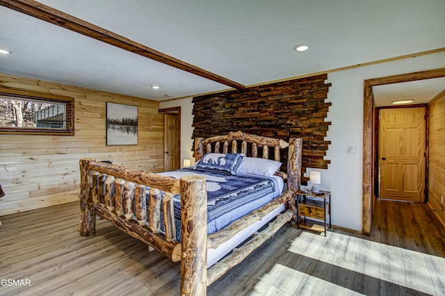 1125 Tanrac Trl, Gatlinburg, TN 37738 - bedroom with wooden walls, wood finished floors, and recessed lighting