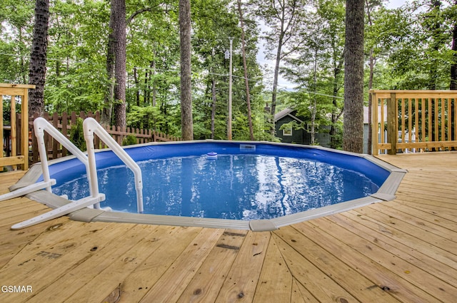 1125 Tanrac Trl, Gatlinburg, TN 37738 - outdoor pool featuring fence and a wooden deck