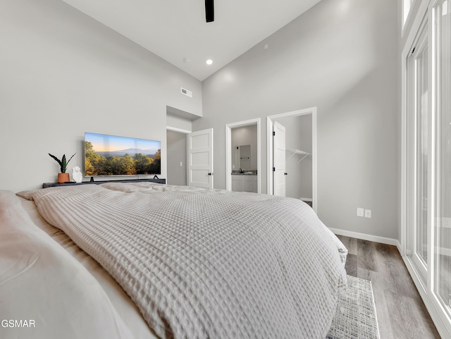 3141 Teaster Ln Unit 1, Pigeon Forge, TN 37863 - bedroom featuring high vaulted ceiling, wood finished floors, a spacious closet, recessed lighting, and a closet