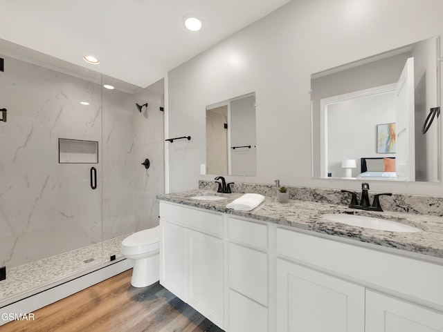 3141 Teaster Ln Unit 1, Pigeon Forge, TN 37863 - full bath featuring a marble finish shower, double vanity, wood finished floors, and recessed lighting
