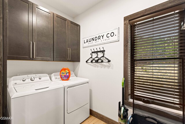4408 Stackstone Rd, Sevierville, TN 37862 - laundry room featuring cabinet space, independent washer and dryer, and light wood-style floors