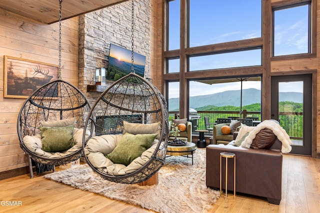 4408 Stackstone Rd, Sevierville, TN 37862 - living room featuring hardwood / wood-style floors, wood walls, and a high ceiling