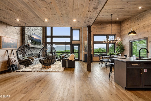 4408 Stackstone Rd, Sevierville, TN 37862 - living room with wood ceiling, light wood-style flooring, a chandelier, wooden walls, and recessed lighting