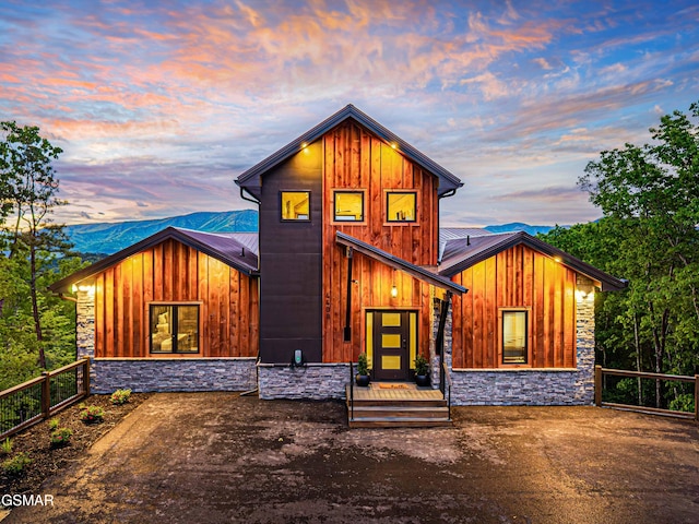 4408 Stackstone Rd, Sevierville, TN 37862 - view of front of house with stone siding, board and batten siding, and a metal roof