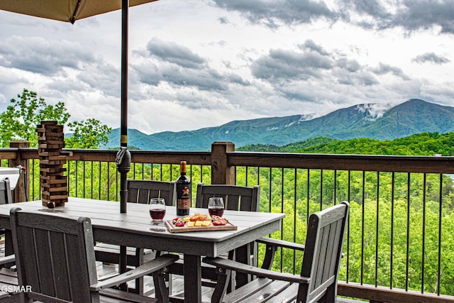 4408 Stackstone Rd, Sevierville, TN 37862 - wooden deck featuring a mountain view and outdoor dining area