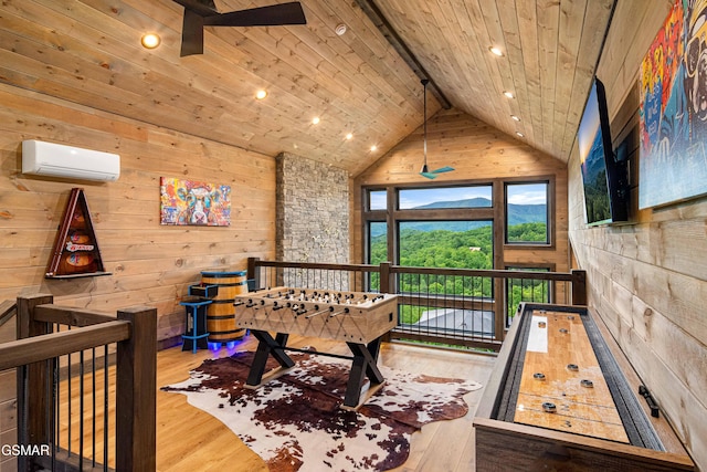 4408 Stackstone Rd, Sevierville, TN 37862 - rec room with a wall mounted air conditioner, wood ceiling, hardwood / wood-style floors, wood walls, and ceiling fan