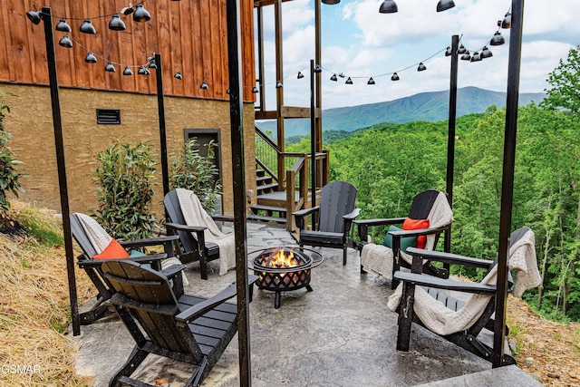 4408 Stackstone Rd, Sevierville, TN 37862 - view of patio / terrace with an outdoor fire pit, stairway, and a mountain view