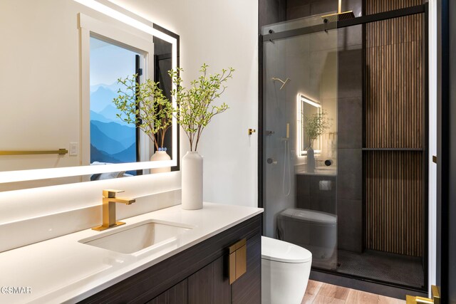 1163 Reedmont Way, Sevierville, TN 37876 - full bathroom with a stall shower, vanity, and wood finished floors