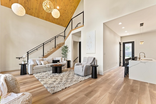 1163 Reedmont Way, Sevierville, TN 37876 - living area with stairway, light wood-style flooring, high vaulted ceiling, recessed lighting, and wood ceiling