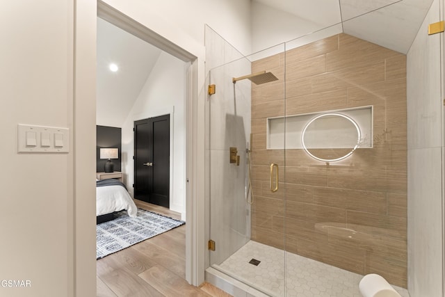1163 Reedmont Way, Sevierville, TN 37876 - full bath with lofted ceiling, wood finished floors, a stall shower, and ensuite bath