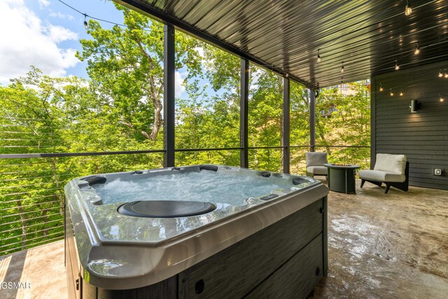 1163 Reedmont Way, Sevierville, TN 37876 - sunroom featuring a hot tub and healthy amount of natural light