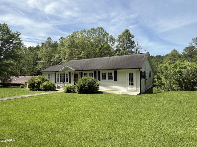 3380 Grassy Fork Rd, Hartford, TN 37753 - ranch-style house with a front lawn, covered porch, and a shingled roof