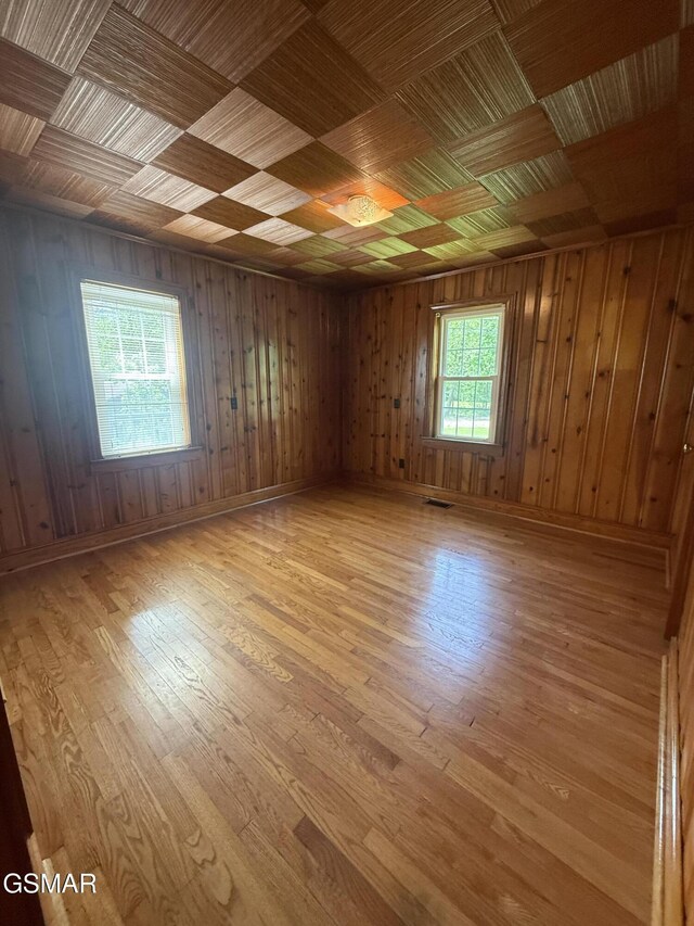 3380 Grassy Fork Rd, Hartford, TN 37753 - empty room with hardwood / wood-style floors, wood walls, and baseboards