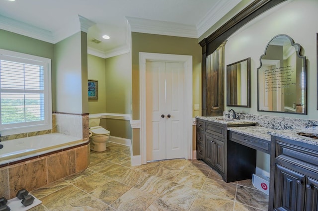 bathroom featuring vanity, toilet, ornamental molding, and tiled tub