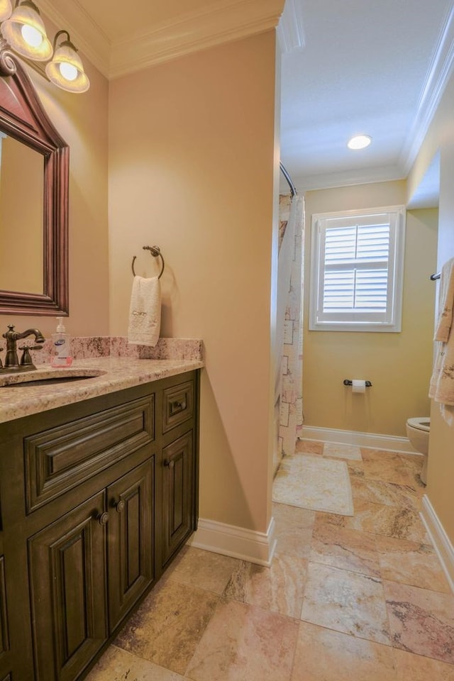 bathroom featuring toilet, vanity, a shower with shower curtain, and ornamental molding