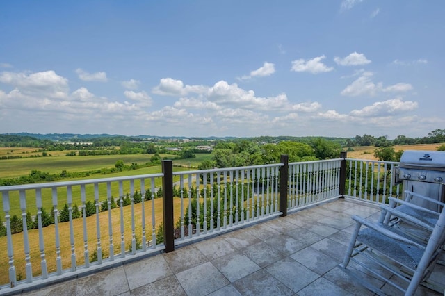 balcony featuring a grill and a rural view