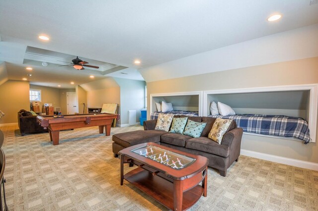 carpeted living room with ceiling fan and pool table