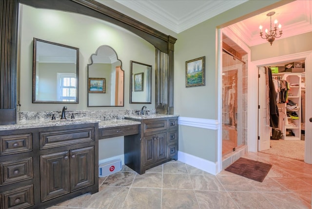 bathroom featuring tile patterned floors, crown molding, a chandelier, an enclosed shower, and vanity