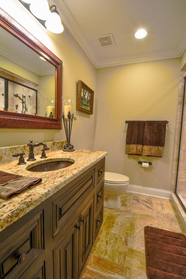 bathroom featuring vanity, toilet, and crown molding