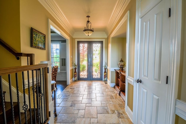 foyer entrance featuring french doors and ornamental molding