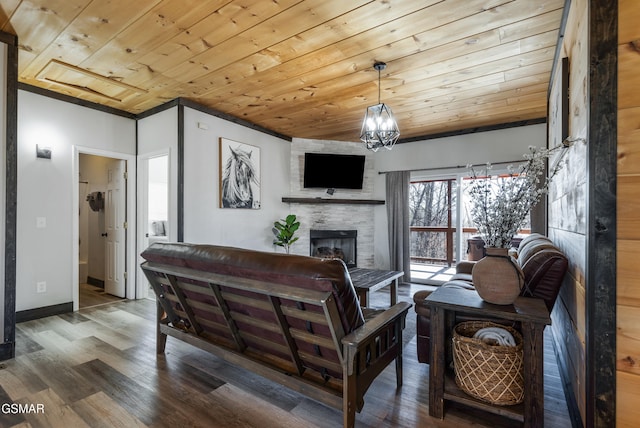 living area featuring wood ceiling, a large fireplace, baseboards, and wood finished floors