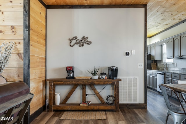 room details with wooden ceiling, visible vents, dishwasher, and wood finished floors