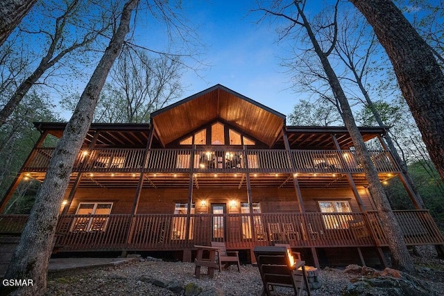 view of back house at dusk