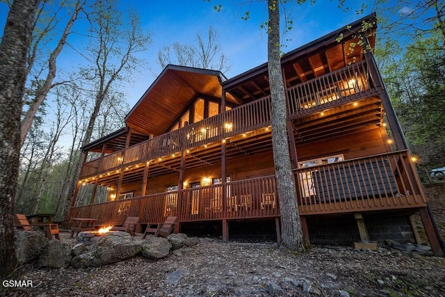 back house at dusk with a fire pit