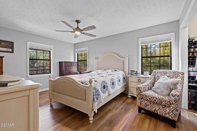 3225 Laurelwood Ave, Sevierville, TN 37862 - bedroom featuring wood finished floors and a textured ceiling
