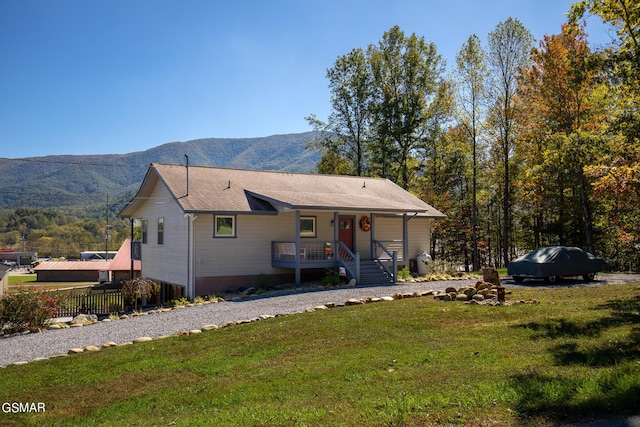 3225 Laurelwood Ave, Sevierville, TN 37862 - view of front of home featuring a porch, a front lawn, and a mountain view