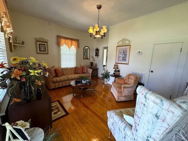 living room with a chandelier and wood-type flooring