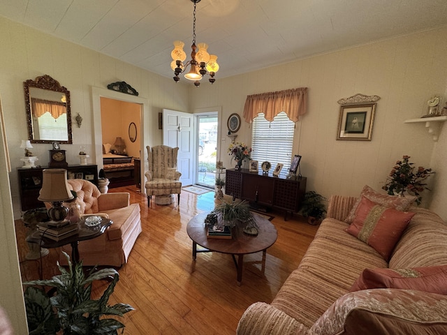 living room featuring a chandelier and hardwood / wood-style flooring