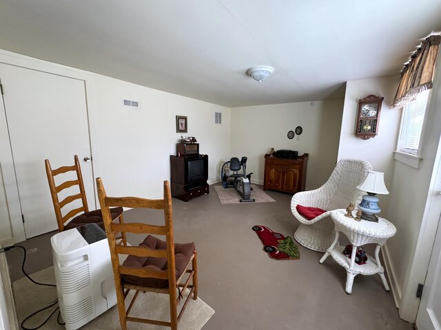 sitting room with concrete floors