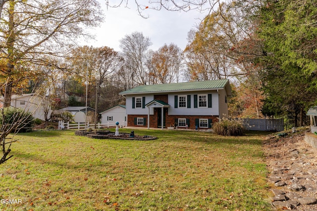 raised ranch with a front lawn