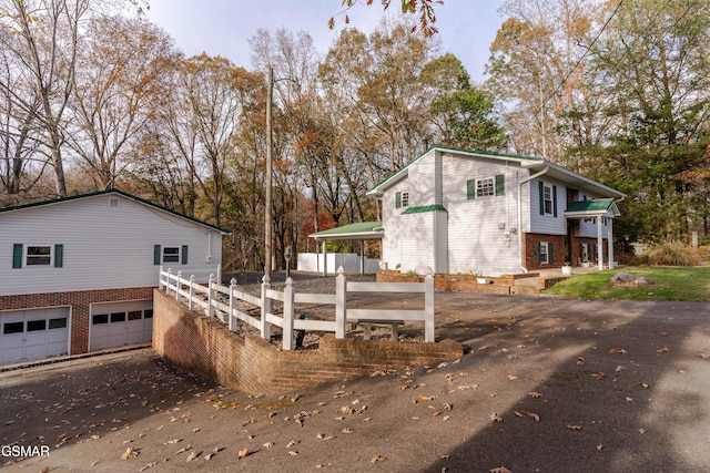 view of side of property with a garage