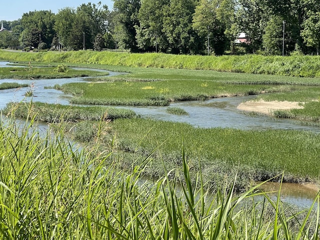 surrounding community with a water view