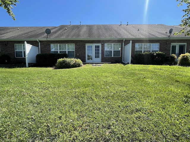 back of house with a yard