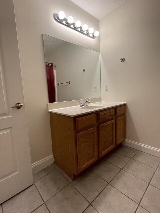 bathroom featuring tile patterned floors and vanity