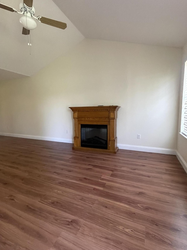 unfurnished living room featuring ceiling fan, dark hardwood / wood-style flooring, and lofted ceiling