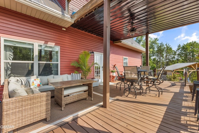 wooden terrace featuring an outdoor living space and outdoor dining area