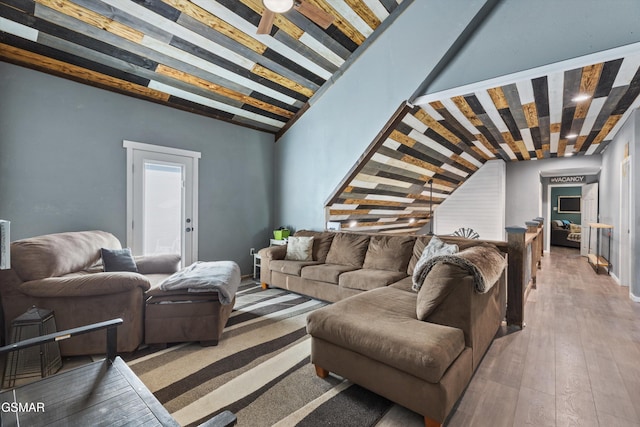 living room featuring hardwood / wood-style floors and beam ceiling