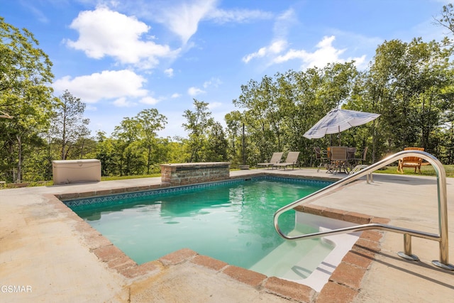 outdoor pool featuring a patio area