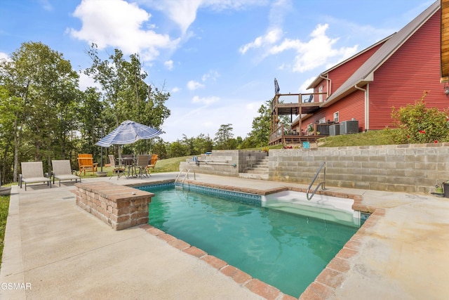 view of swimming pool with central AC, a fenced in pool, a patio, and stairs