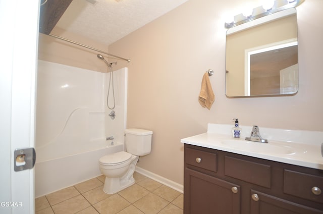 bathroom featuring tile patterned flooring, tub / shower combination, toilet, vanity, and a textured ceiling