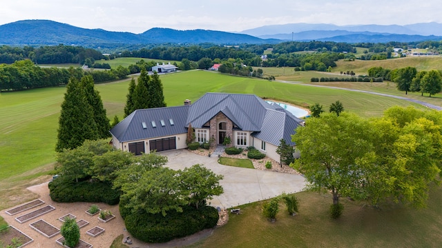 drone / aerial view featuring a rural view and a mountain view